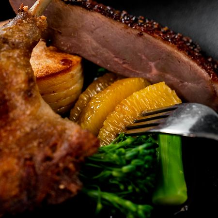 The Point Brisbane Hotel Bagian luar foto A duck confit with orange and vegetables