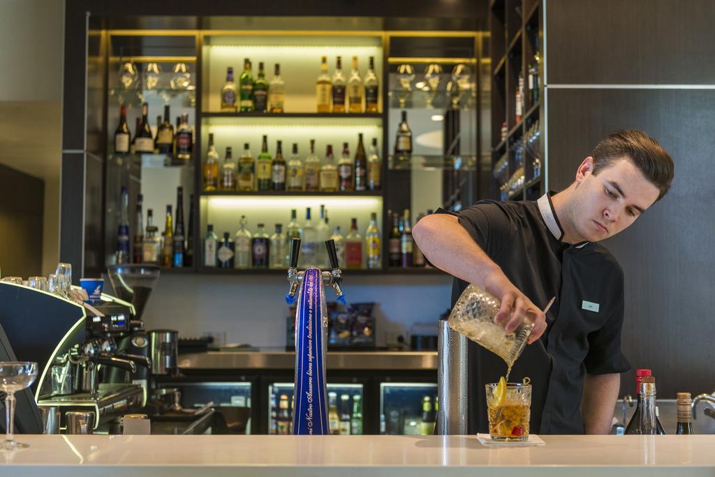 The Point Brisbane Hotel Bagian luar foto A bartender at work